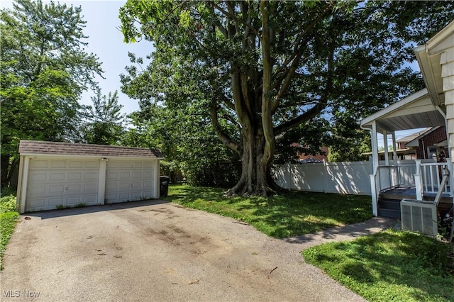 234 E 218th St, Euclid, OH 44123 - view of yard with an outdoor structure and a garage