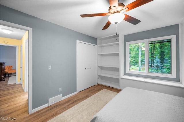 8985 Williams Rd, Chardon, OH 44024 - bedroom featuring wood finished floors, ceiling fan, and a closet
