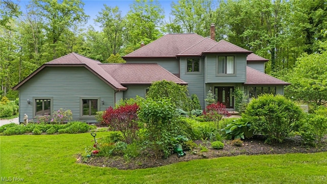 8985 Williams Rd, Chardon, OH 44024 - view of front facade with a chimney and a front lawn