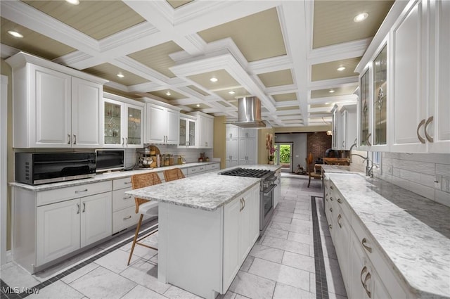 8985 Williams Rd, Chardon, OH 44024 - kitchen featuring stainless steel appliances, exhaust hood, a center island, coffered ceiling, and white cabinetry