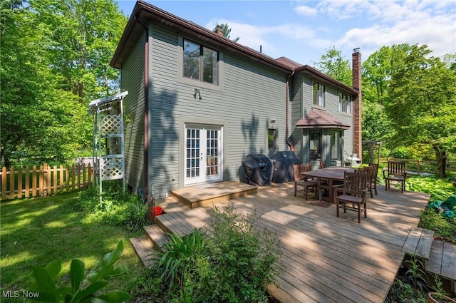 8985 Williams Rd, Chardon, OH 44024 - back of house with french doors, outdoor dining area, a deck, and a chimney