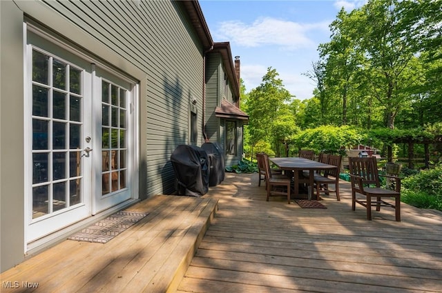8985 Williams Rd, Chardon, OH 44024 - wooden terrace featuring outdoor dining space, a grill, and french doors
