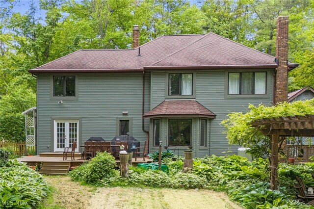 8985 Williams Rd, Chardon, OH 44024 - rear view of property with a chimney, a wooden deck, a shingled roof, and a pergola
