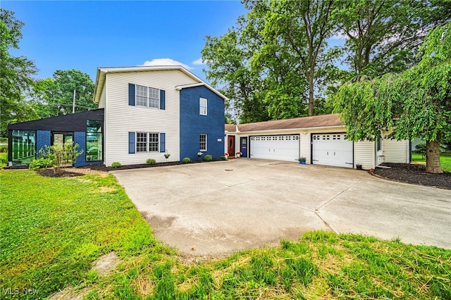 5411 W Heisley Rd, Mentor, OH 44060 - view of side of home with driveway and a yard