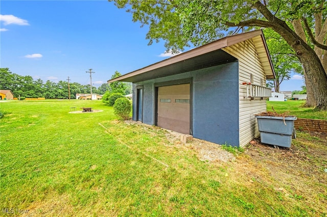 5411 W Heisley Rd, Mentor, OH 44060 - view of green lawn with a detached garage and an outbuilding