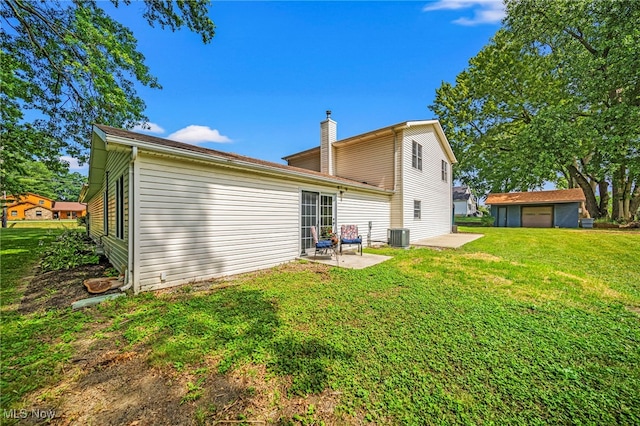 5411 W Heisley Rd, Mentor, OH 44060 - rear view of property featuring a patio area, a yard, and a chimney