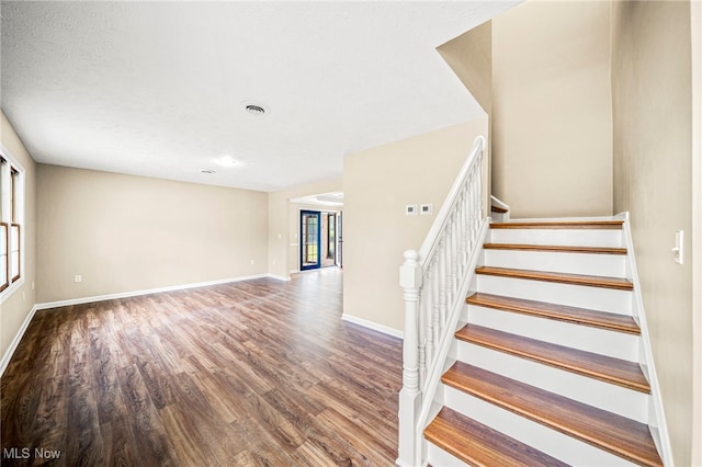5411 W Heisley Rd, Mentor, OH 44060 - staircase with wood finished floors and baseboards