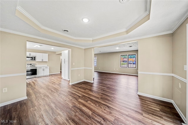5411 W Heisley Rd, Mentor, OH 44060 - unfurnished living room featuring dark wood-style floors, ornamental molding, and a raised ceiling