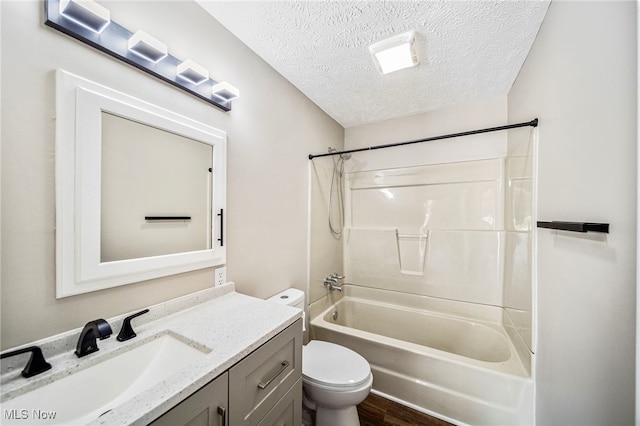 5411 W Heisley Rd, Mentor, OH 44060 - bathroom with a textured ceiling, vanity, bathing tub / shower combination, and wood finished floors