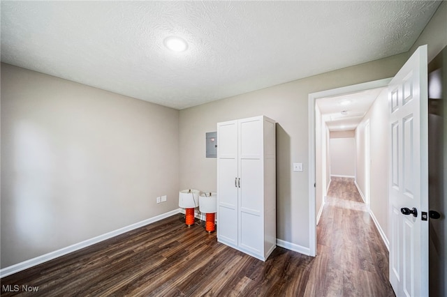 5411 W Heisley Rd, Mentor, OH 44060 - unfurnished bedroom with dark wood finished floors, a textured ceiling, recessed lighting, and a closet