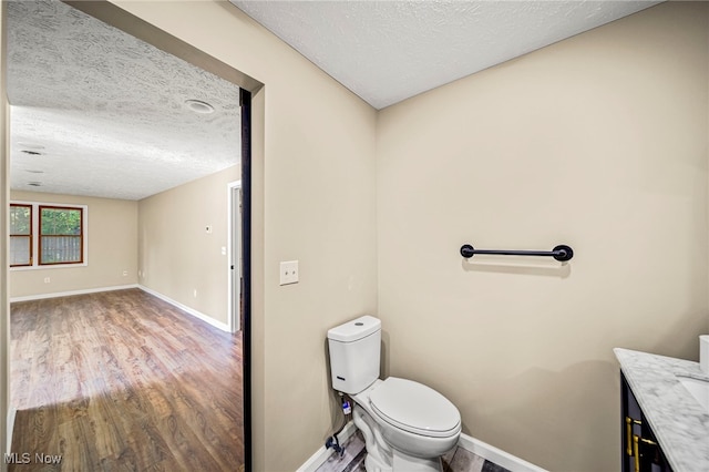 5411 W Heisley Rd, Mentor, OH 44060 - half bath with wood finished floors, a textured ceiling, and vanity