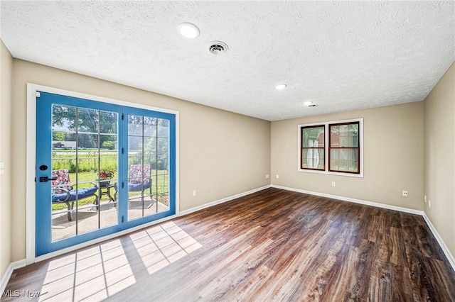 5411 W Heisley Rd, Mentor, OH 44060 - empty room featuring wood finished floors, a textured ceiling, and recessed lighting