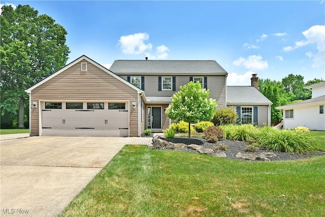 191 Maple Leaf Dr, Hubbard, OH 44425 - traditional-style home featuring driveway, a front lawn, and a garage
