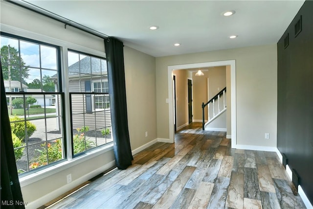 191 Maple Leaf Dr, Hubbard, OH 44425 - empty room featuring wood finished floors, recessed lighting, and stairway