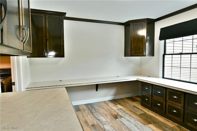 191 Maple Leaf Dr, Hubbard, OH 44425 - unfurnished office with wood finished floors, crown molding, and built in desk