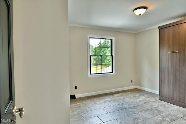 191 Maple Leaf Dr, Hubbard, OH 44425 - unfurnished bedroom featuring ornamental molding and baseboards