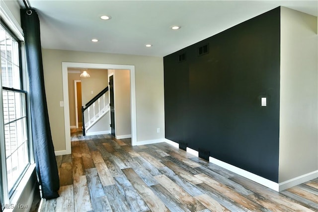 191 Maple Leaf Dr, Hubbard, OH 44425 - spare room featuring stairway, wood finished floors, and recessed lighting