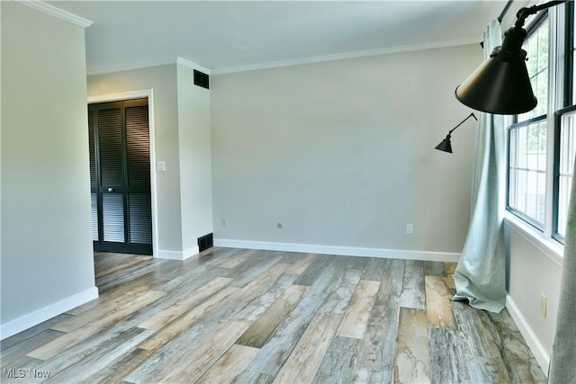 191 Maple Leaf Dr, Hubbard, OH 44425 - unfurnished room with wood finished floors and crown molding