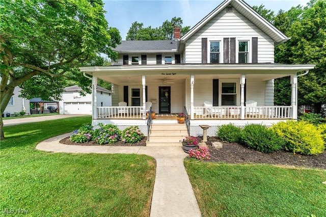 128 Forest Hill Dr, Avon Lake, OH 44012 - view of front of home with covered porch, a front yard, a chimney, and a garage