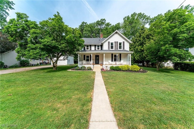 128 Forest Hill Dr, Avon Lake, OH 44012 - view of front of home featuring covered porch, a front lawn, and a chimney