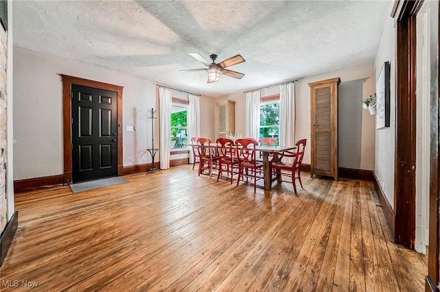 128 Forest Hill Dr, Avon Lake, OH 44012 - dining space with hardwood / wood-style flooring, ceiling fan, and a textured ceiling