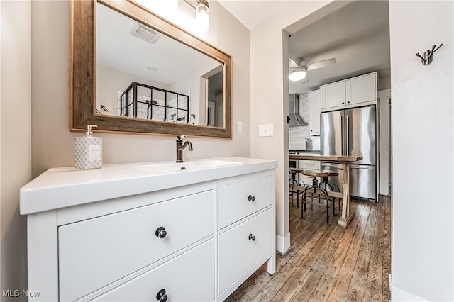 128 Forest Hill Dr, Avon Lake, OH 44012 - bathroom featuring vanity and hardwood / wood-style floors