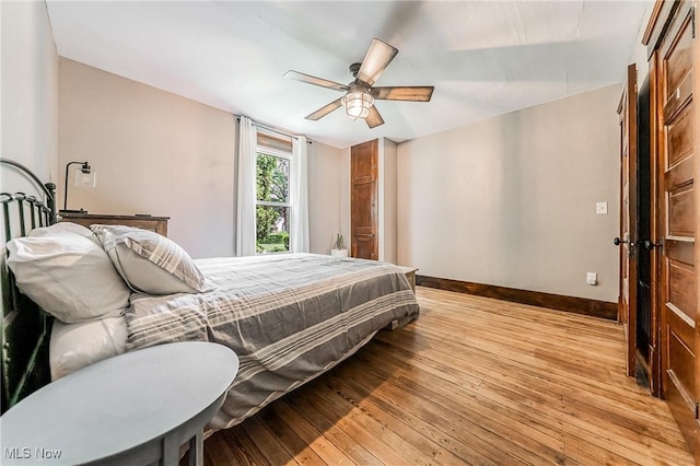 128 Forest Hill Dr, Avon Lake, OH 44012 - bedroom with light wood-style flooring and ceiling fan