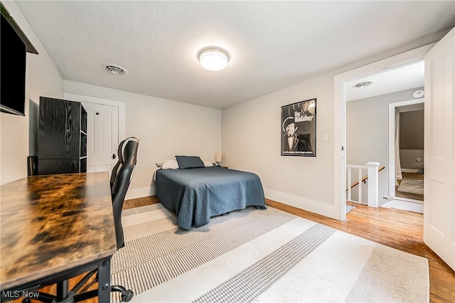 128 Forest Hill Dr, Avon Lake, OH 44012 - bedroom featuring light wood-style flooring and baseboards