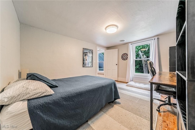 128 Forest Hill Dr, Avon Lake, OH 44012 - bedroom featuring a desk and wood finished floors