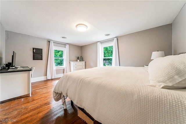 128 Forest Hill Dr, Avon Lake, OH 44012 - bedroom featuring hardwood / wood-style flooring and multiple windows