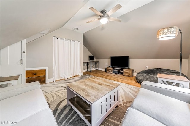 128 Forest Hill Dr, Avon Lake, OH 44012 - living area with wood finished floors, a ceiling fan, and lofted ceiling