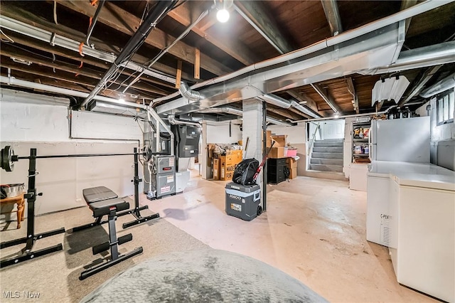 128 Forest Hill Dr, Avon Lake, OH 44012 - unfinished basement with freestanding refrigerator, stairs, and refrigerator