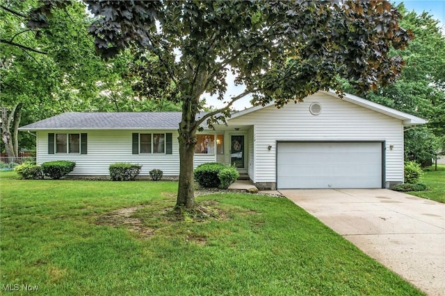 114 Corrin Cir, Cortland, OH 44410 - single story home with a garage, concrete driveway, and a front yard