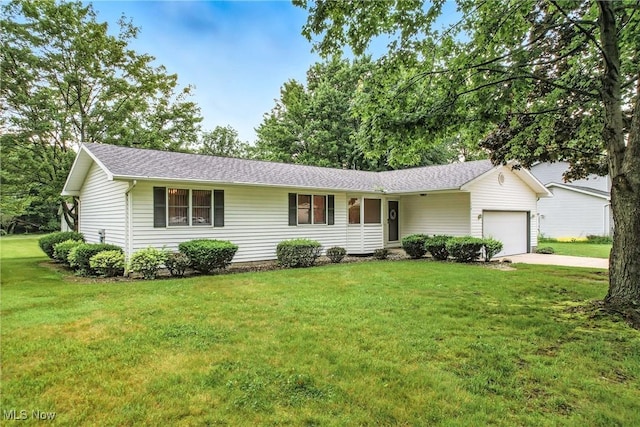 114 Corrin Cir, Cortland, OH 44410 - ranch-style home featuring a garage, driveway, a front lawn, and roof with shingles