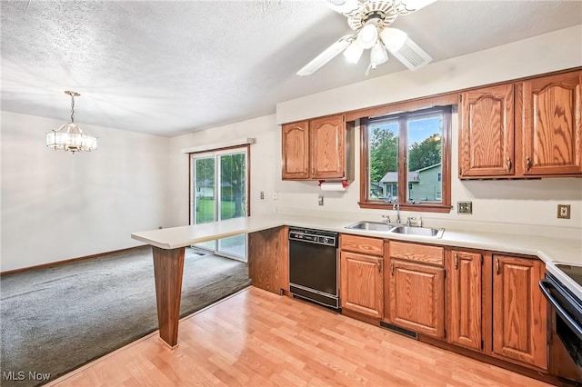 114 Corrin Cir, Cortland, OH 44410 - kitchen with dishwasher, stove, brown cabinetry, and a textured ceiling
