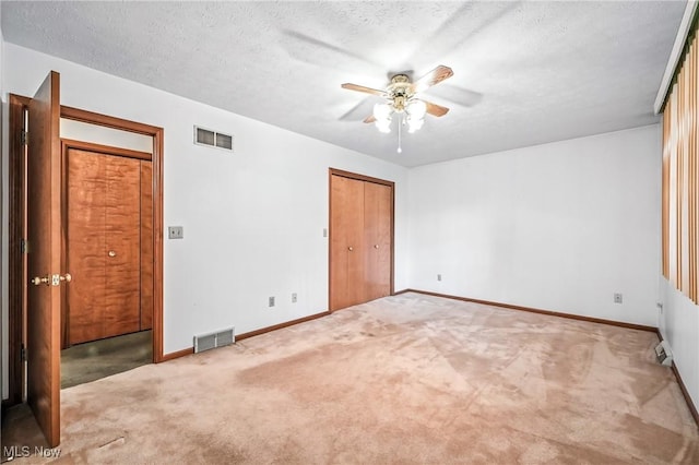 114 Corrin Cir, Cortland, OH 44410 - unfurnished bedroom with carpet floors, a textured ceiling, a closet, and a ceiling fan