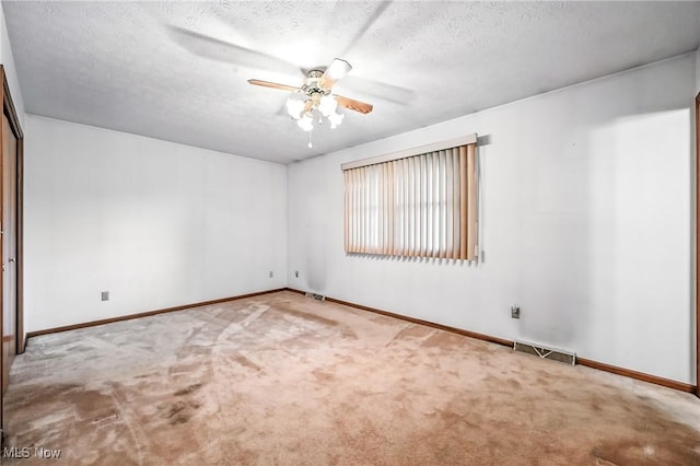 114 Corrin Cir, Cortland, OH 44410 - empty room featuring carpet flooring, ceiling fan, and a textured ceiling
