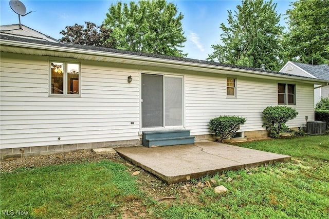 114 Corrin Cir, Cortland, OH 44410 - back of property with entry steps, a patio, and a lawn