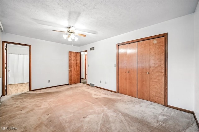 114 Corrin Cir, Cortland, OH 44410 - unfurnished bedroom with carpet flooring, a ceiling fan, and a textured ceiling
