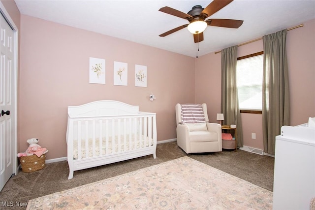 18259 William Dr, Doylestown, OH 44230 - carpeted bedroom featuring a crib, a closet, and a ceiling fan