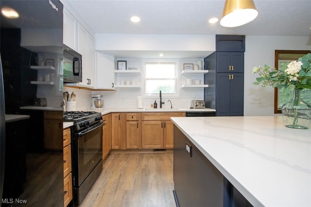 18259 William Dr, Doylestown, OH 44230 - kitchen with black appliances, open shelves, tasteful backsplash, light wood finished floors, and recessed lighting