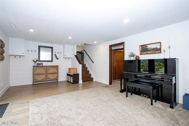 18259 William Dr, Doylestown, OH 44230 - living area featuring stairway, recessed lighting, light wood finished floors, and light carpet