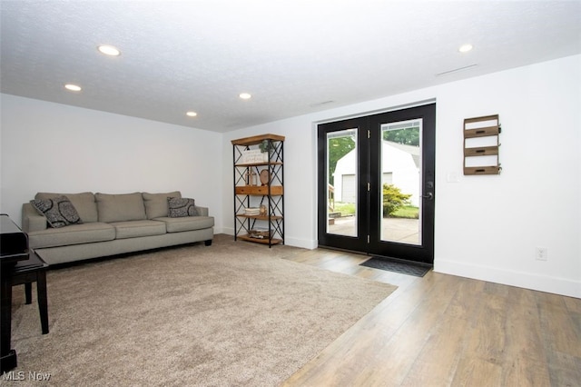18259 William Dr, Doylestown, OH 44230 - living area with recessed lighting, wood finished floors, and french doors
