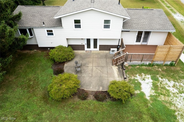 18259 William Dr, Doylestown, OH 44230 - rear view of house with roof with shingles, a patio area, a yard, and a deck