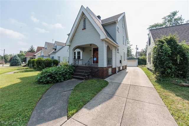3817 Washington Park Blvd, Newburgh Heights, OH 44105 - view of front of home with an outdoor structure, a front yard, and a detached garage