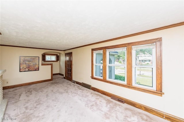 3817 Washington Park Blvd, Newburgh Heights, OH 44105 - spare room with light colored carpet, arched walkways, and crown molding
