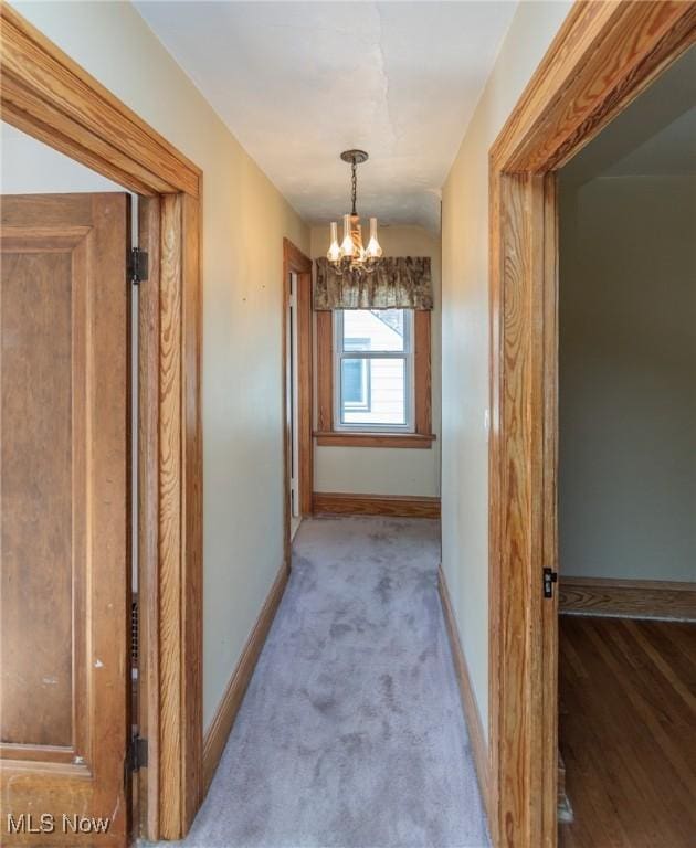 3817 Washington Park Blvd, Newburgh Heights, OH 44105 - corridor featuring a chandelier and carpet flooring
