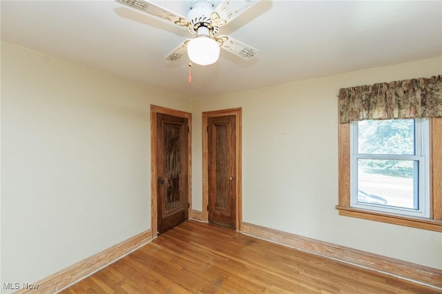 3817 Washington Park Blvd, Newburgh Heights, OH 44105 - unfurnished room with light wood-style floors and ceiling fan