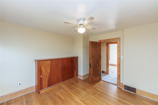 3817 Washington Park Blvd, Newburgh Heights, OH 44105 - empty room featuring light wood finished floors and ceiling fan