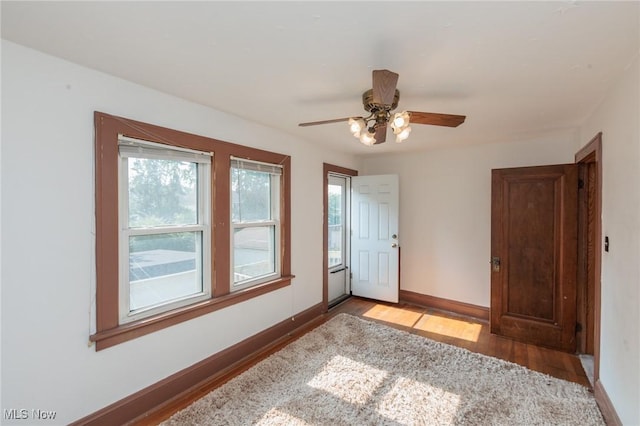 3817 Washington Park Blvd, Newburgh Heights, OH 44105 - empty room with light wood finished floors and ceiling fan